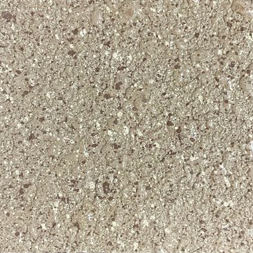 Close-up of a textured, speckled stone surface in beige tones.
