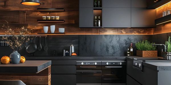 Modern kitchen with black cabinetry, warm wood accents, and ambient lighting.
