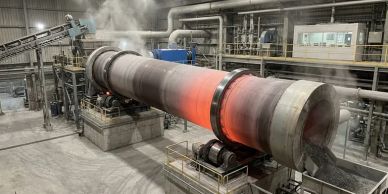 Industrial furnace glowing red inside a factory.