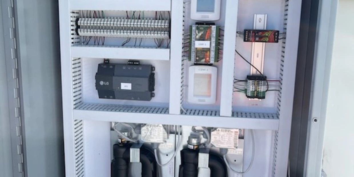 Electrical control panel with wiring and components.