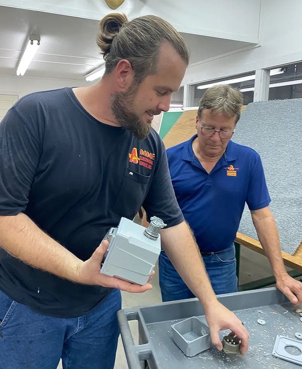 Father and Son working on a electrical cord project 