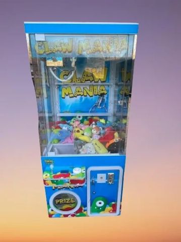 Brightly colored Claw Mania arcade claw machine filled with plush toys.