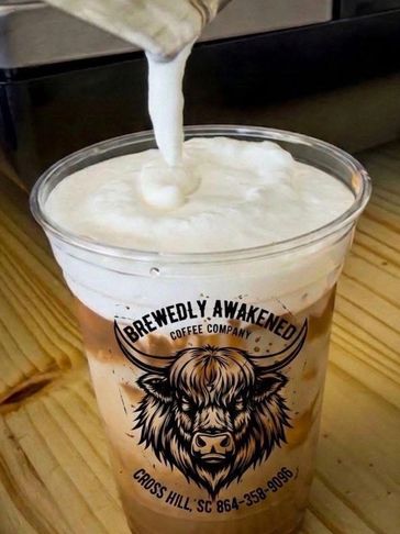 Iced coffee topped with creamy foam from Brewedly Awakened Coffee Company.