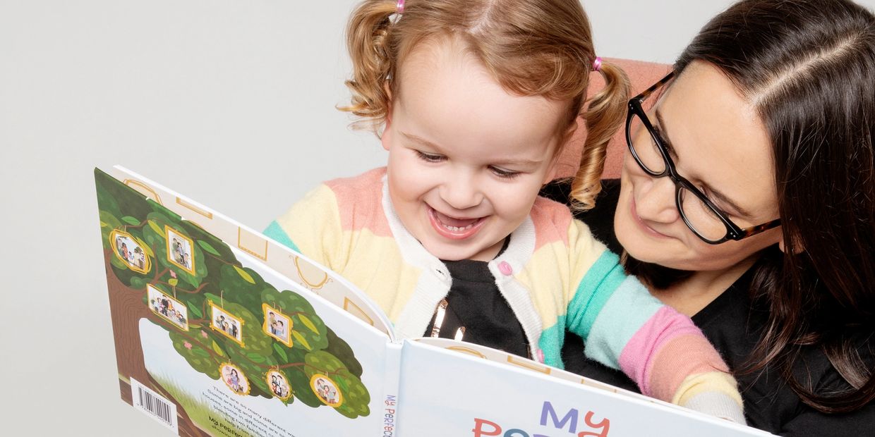 Mother and daughter reading My Perfect Family by Alisha Burns