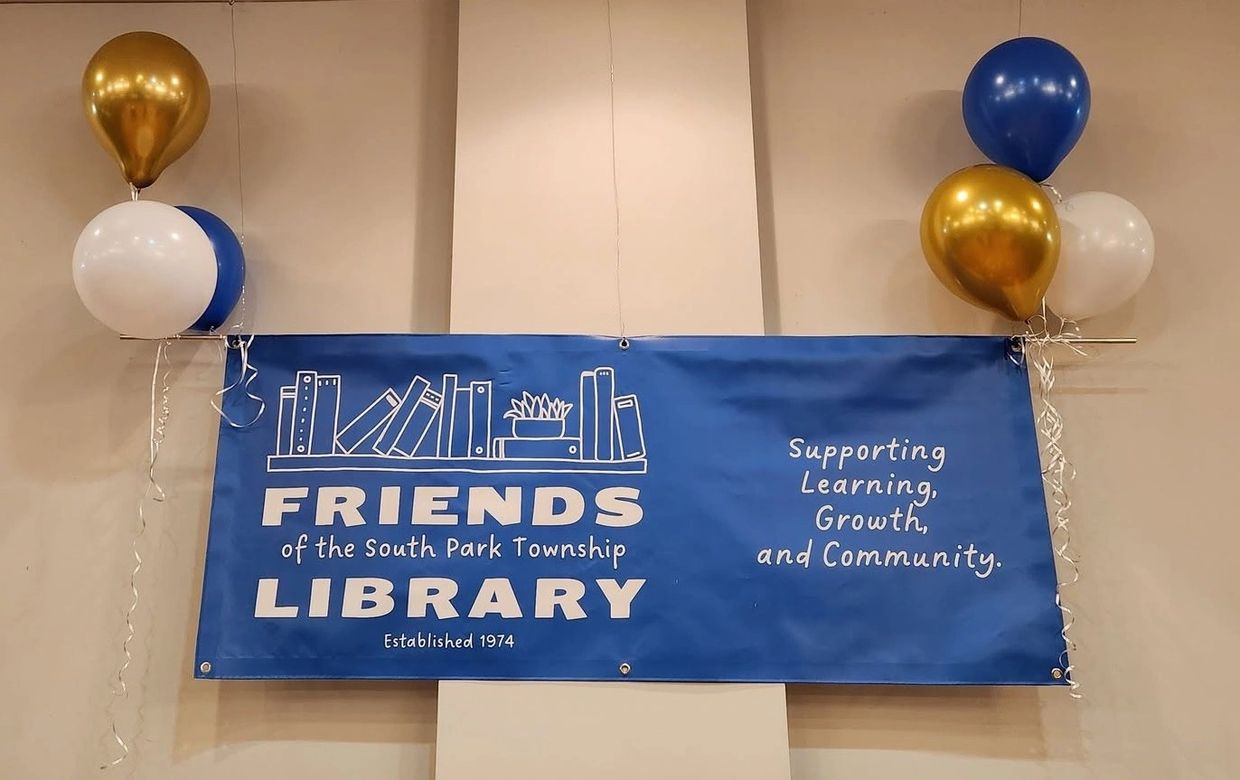 Blue banner for Friends of the South Park Township Library with gold, white, and blue balloons.