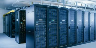 Rows of black server racks in a modern data center.