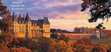 Biltmore Estate in Asheville, NC at sunset with autumn foliage.