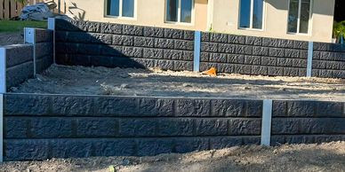 Dark Dark Concrete Sleeper Retaining Wall and Garden Area