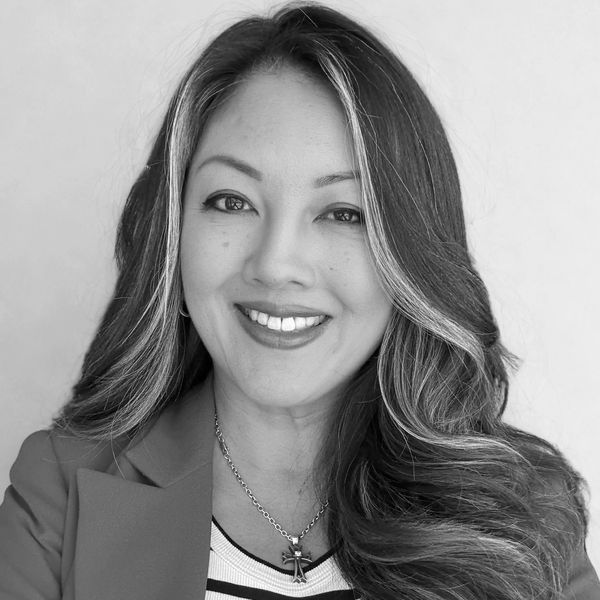 Black and white headshot of an asian female