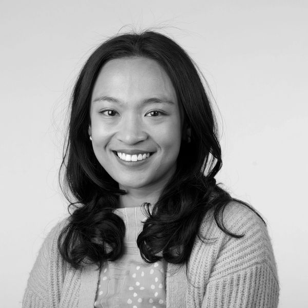 black and white photo of a woman smiling