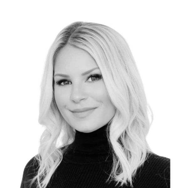 black and white headshot of a woman smiling