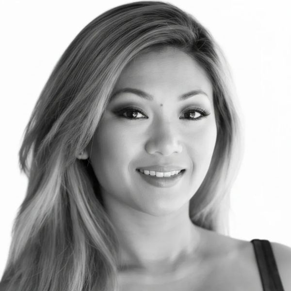 black and white headshot of a woman smiling