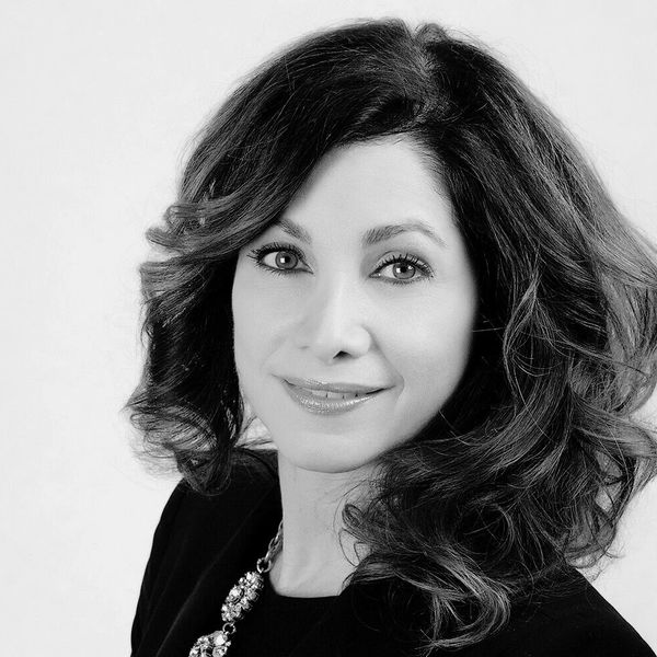 black and white headshot of a woman smiling