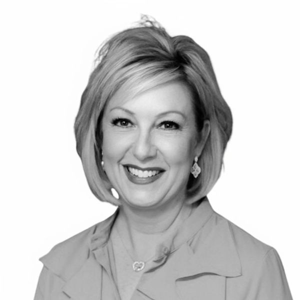 black and white headshot of a woman smiling