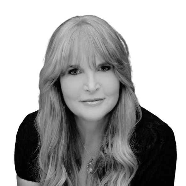 black and white headshot of a woman with bangs and long hair