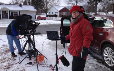 Teleprompter Operator prompting outdoors in snow