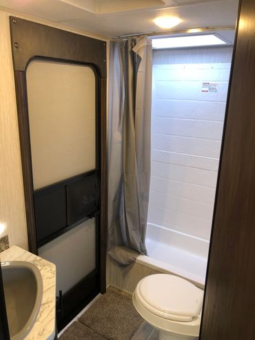 Bathroom in Cherokee Camper for Rent in Sivler Lake Michigan Delivered and Setup on your campsite