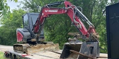 Excavator ready for horse and livestock burial service in Central Texas