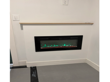 Modern electric fireplace with green flames installed in a white wall.
building projects
custom homes
renovation services