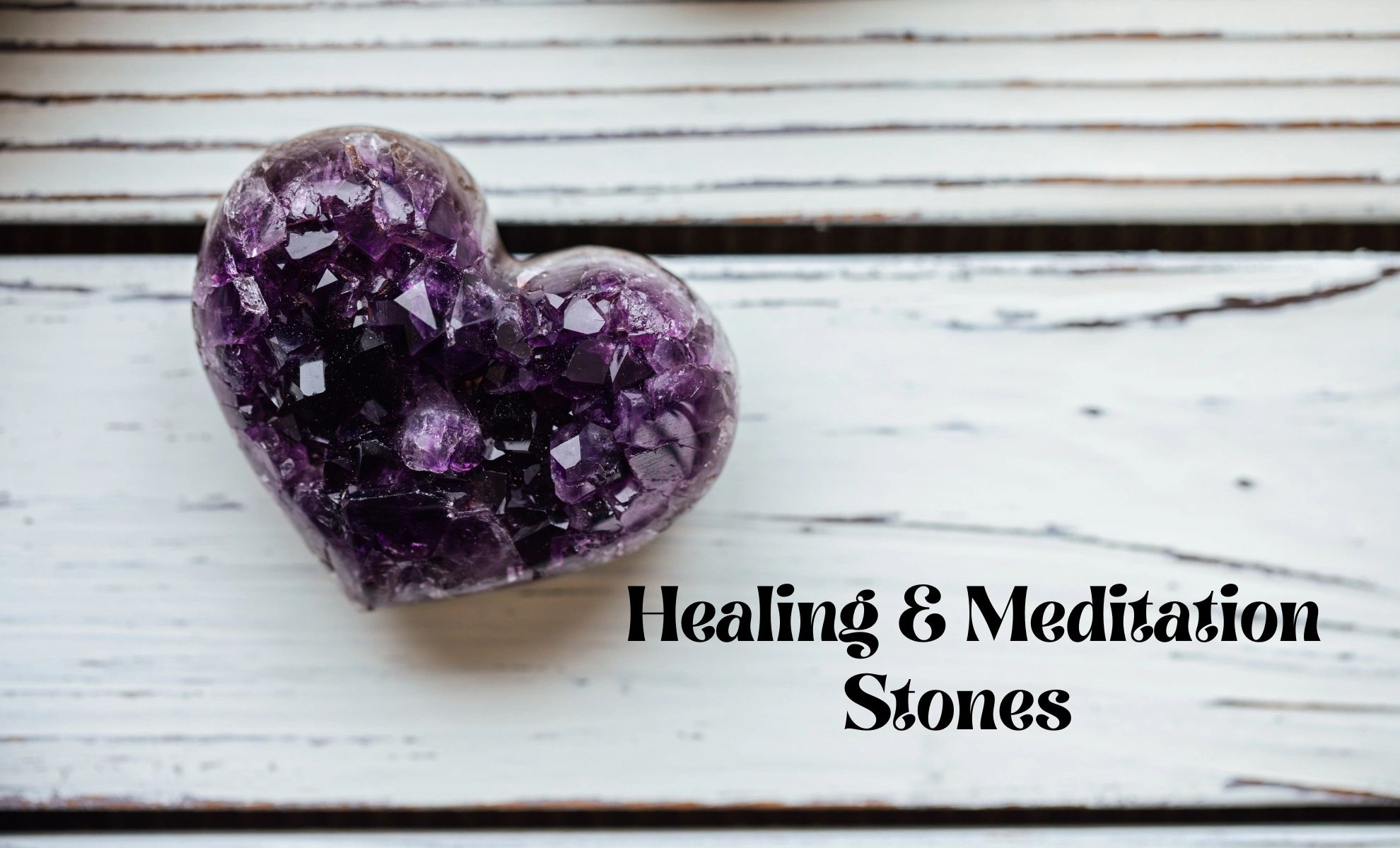 Heart-shaped amethyst crystal on a rustic wooden surface with healing and meditation text.