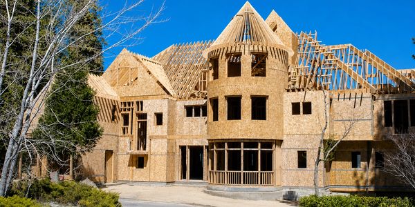 House under construction with wooden framing.