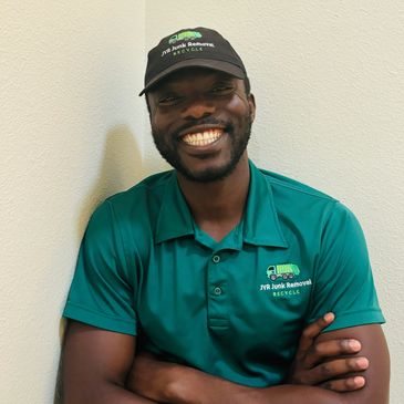 Smiling picture of a junk removal service project manager 