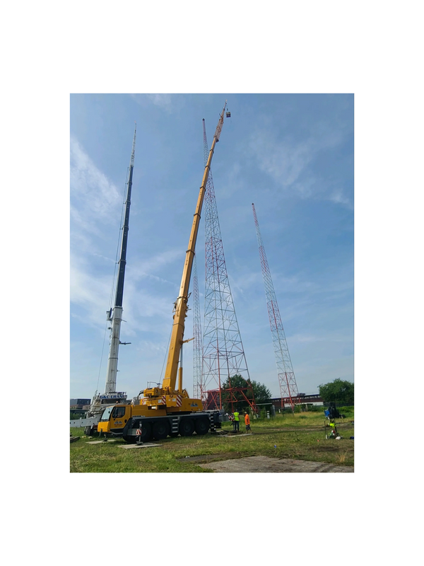 Our LTM 1100 2 men in a man basket 300 feet in the sky and our LTM 1220 Dismantling radio antennas 