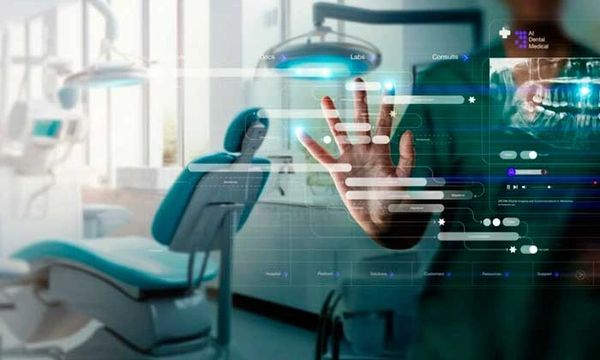 A hand interacts with a futuristic digital interface in a dental clinic.