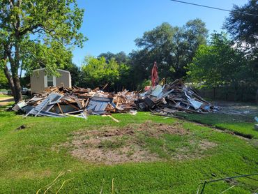 Debris from a demolished building on a sunny day.