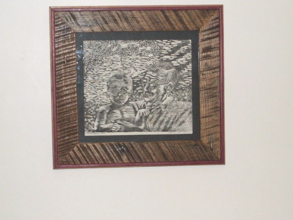 This is a block print my daughter did of her grandfather holding her when she was one yr. old. It lo