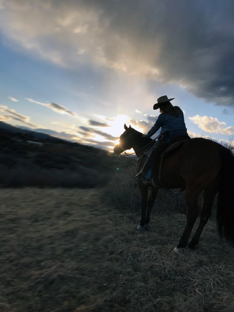 IRELAND Rae Creative photo shoot, cowgirl on horse at sunset.