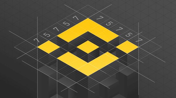 3D yellow and black Binance logo on a gray grid background.