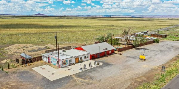 Rural gas station and convenience store in open landscape.