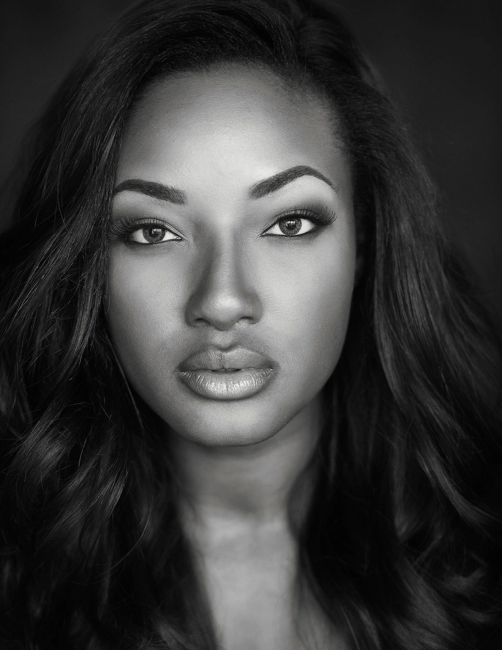 Black and white close-up portrait of a woman.