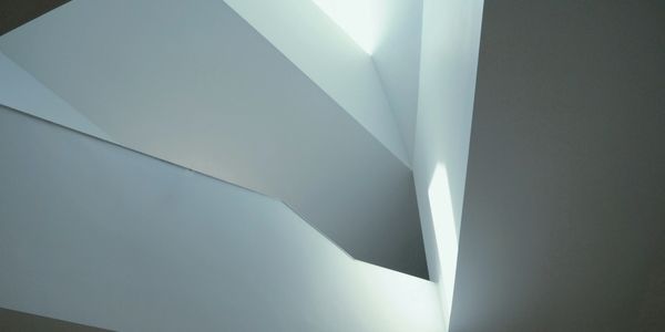 Abstract architectural interior with sharp lines and light.