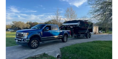 Truck delivering a 20 yard dumpster bin in Caldwell County