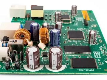 Close-up of an electronic circuit board with capacitors and chips.