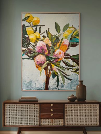 Abstract floral painting above a mid-century modern wooden sideboard with decorative vases.