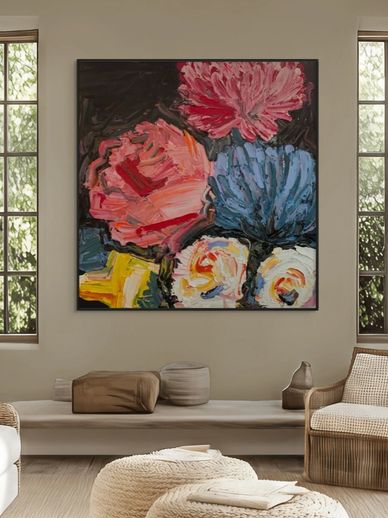 Abstract floral painting in vibrant colors hangs in a cozy living room.