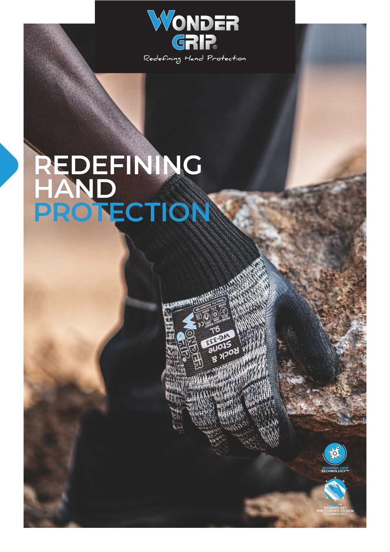 Worker wearing Wonder Grip protective gloves handling a rock safely.