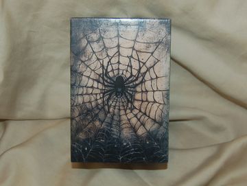 Box with spider and web design.