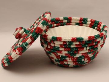 Colorful woven basket with lid.
