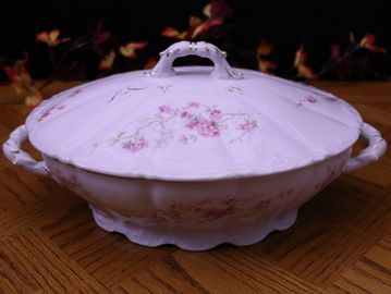 Antique Covered Vegetable Dish crafted in Weimar Germany. It is white with pink flowers. 