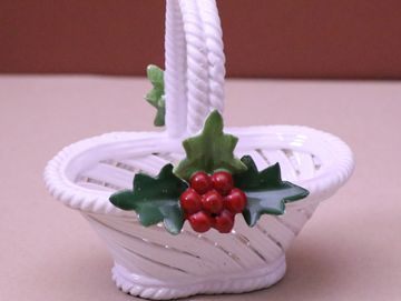 White porcelain basket with holly and berry decorations.
