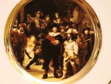 Artistic plate with a classic painting scene.