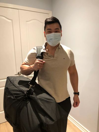 chiropractor holding a portable chiropractic table