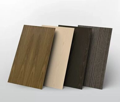 Sample boards showcasing wood finishes: warm oak, light ash, deep walnut, and textured dark grain.