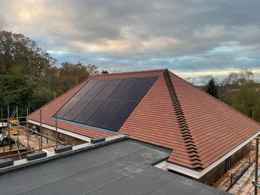 New tile roof with solar panels.