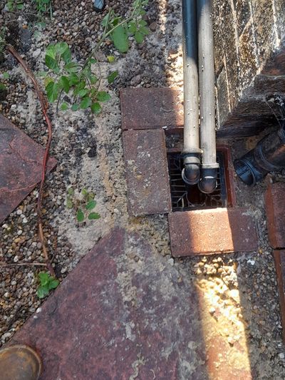 A blocked drain causing an overflow of sewage has been cleared.
