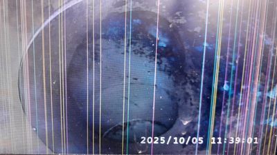 Flow is being restored to a blocked drain and relative performance checked by CCTV.